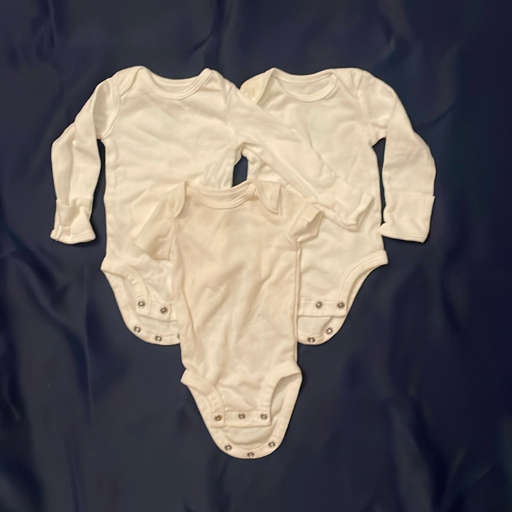Lot of white newborn onsies